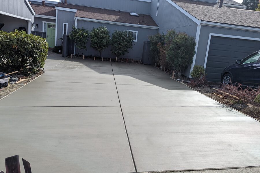 Broom finish concrete driveway on a hillside property