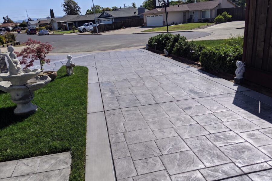 Gray stamped concrete driveway with slate pattern