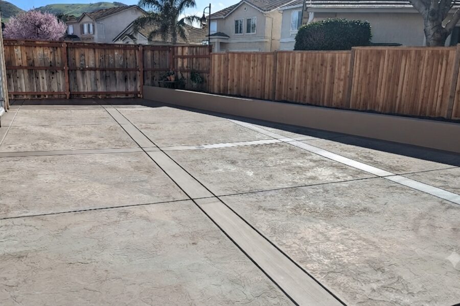Stamped concrete backyard patio with decorative finish